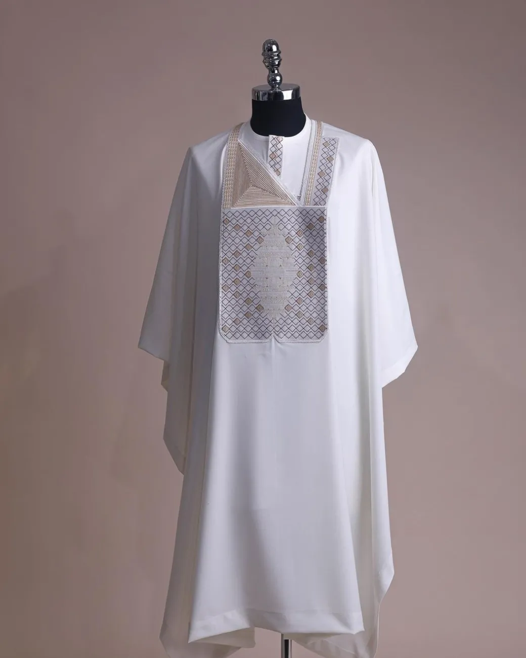 An Ivory white, chinoiserie chic pagoda with layers metallic wire embroidery details agbada