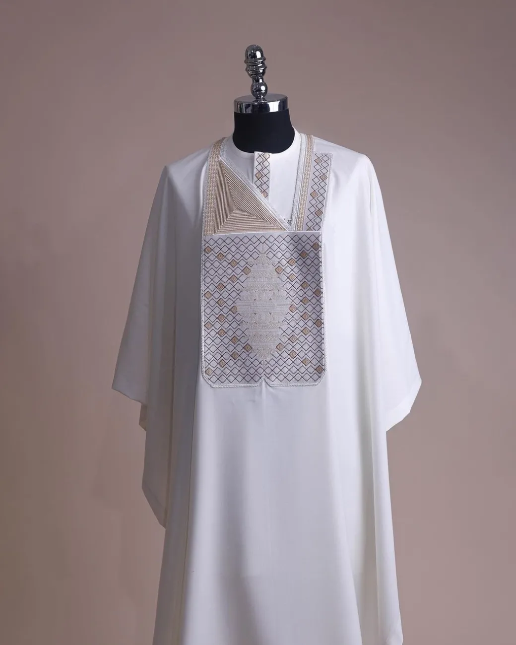 An Ivory white, chinoiserie chic pagoda with layers metallic wire embroidery details agbada