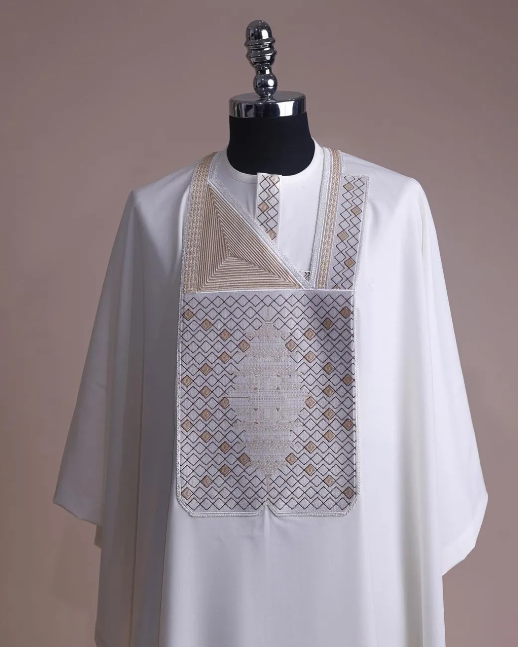 An Ivory white, chinoiserie chic pagoda with layers metallic wire embroidery details agbada