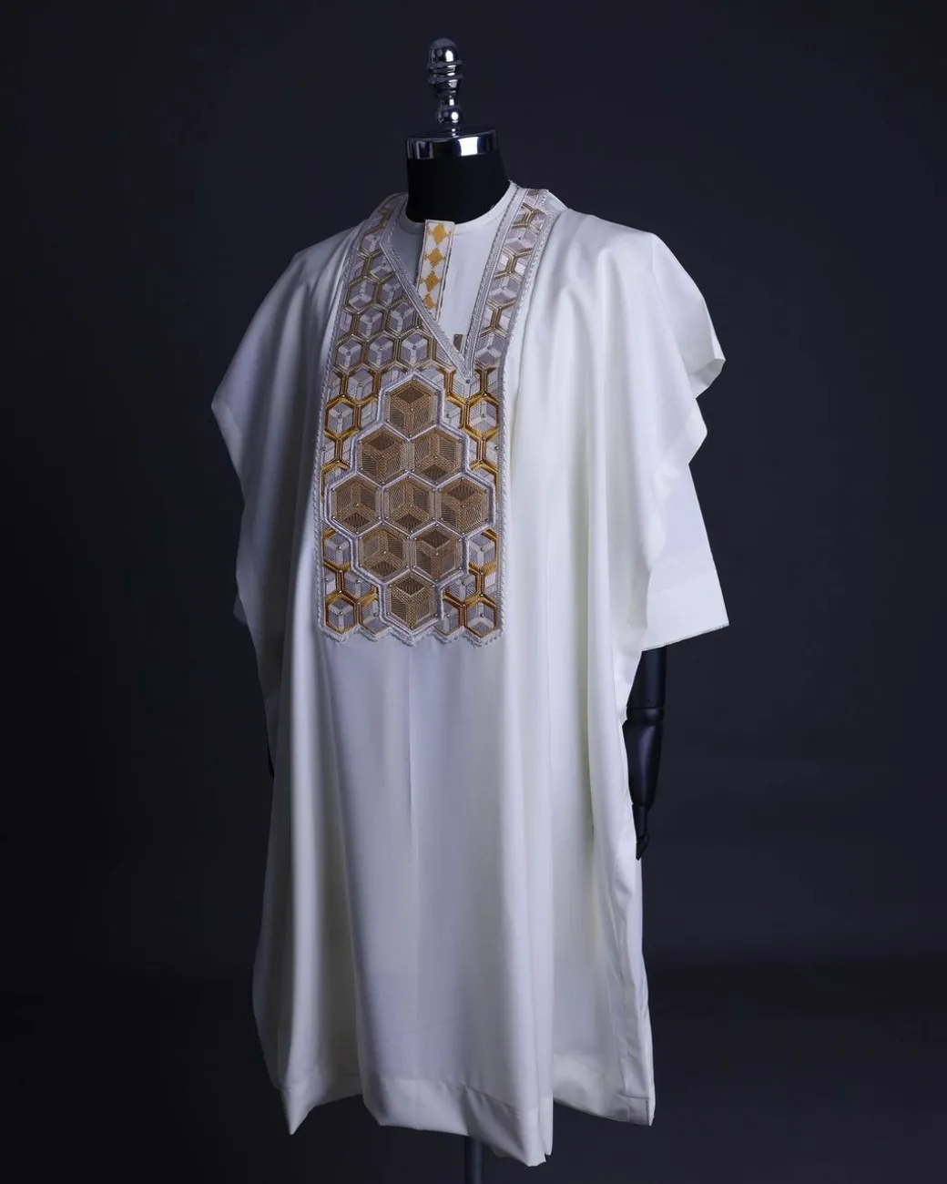 An Ivory White, Connected inverted cube -layered 3D embroidery design with splashed gold ss30 Swarovski stone details Agbada