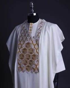 An Ivory White, Connected inverted cube -layered 3D embroidery design with splashed gold ss30 Swarovski stone details Agbada