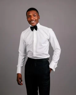 An Ivory white, covered button flap, tuxedo shirt.