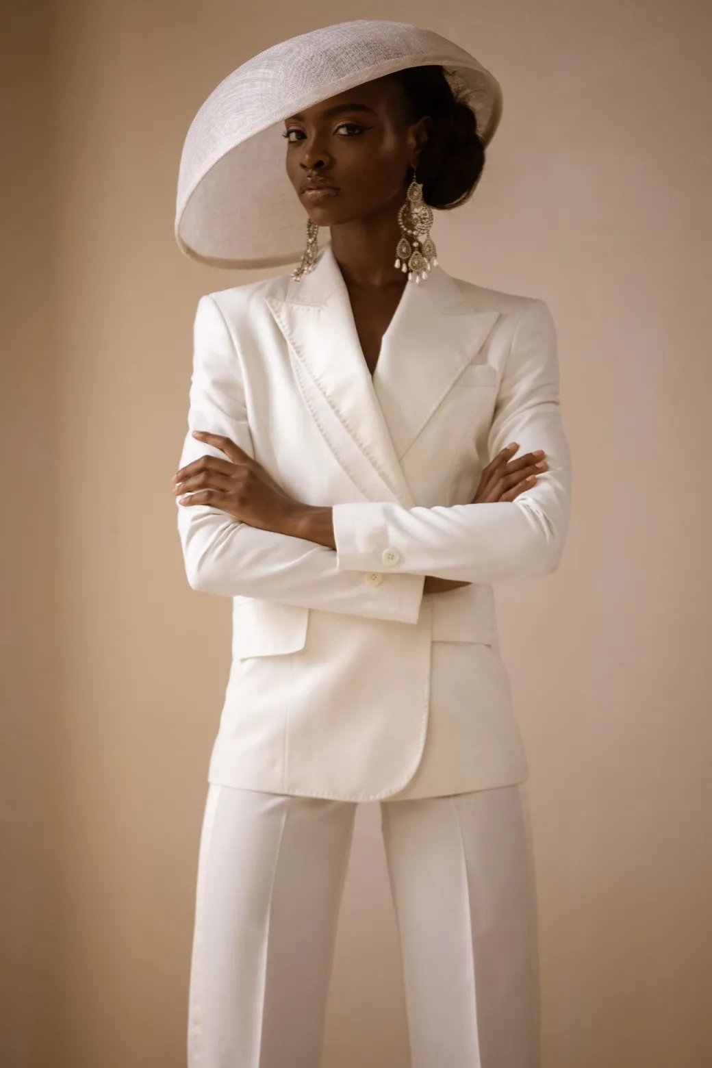 An Ivory White Cross Tuxedo Bridal Suit