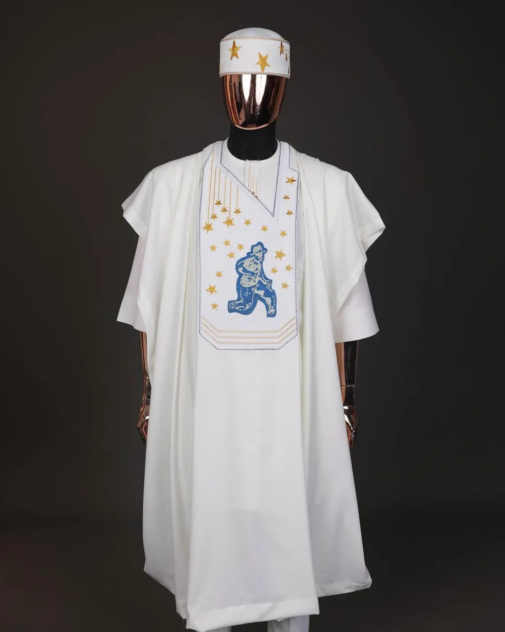 An Ivory white, dropping stars and bender knees metallic wire embroidery details agbada