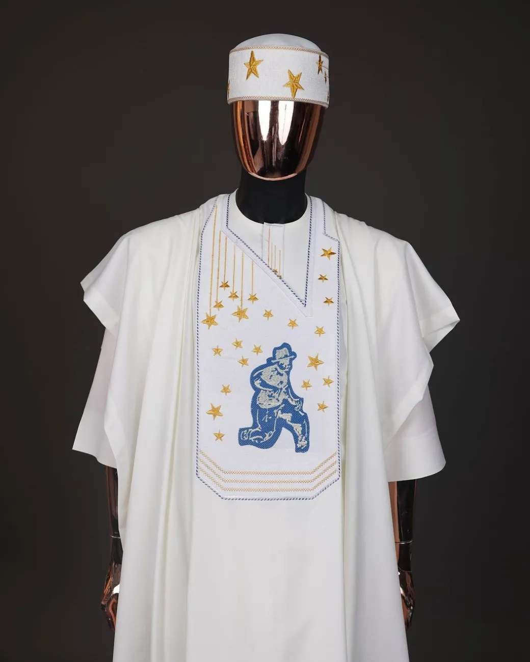 An Ivory white, dropping stars and bender knees metallic wire embroidery details agbada
