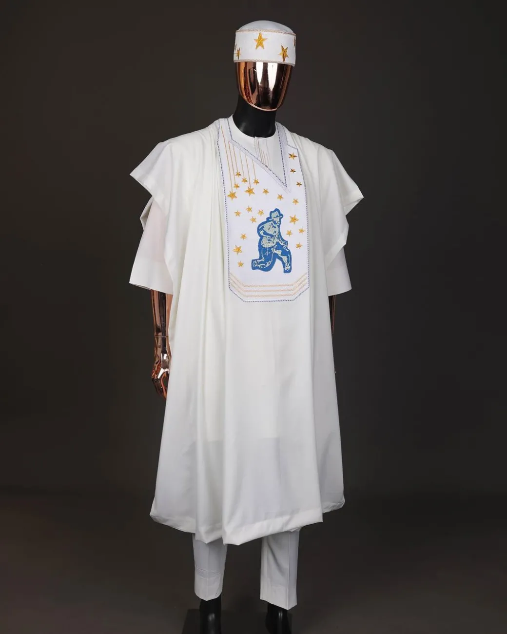 An Ivory white, dropping stars and bender knees metallic wire embroidery details agbada