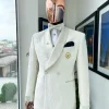 An ivory white Egyptian scritto pattern jacquard shawl lapel single button, double breasted Suit