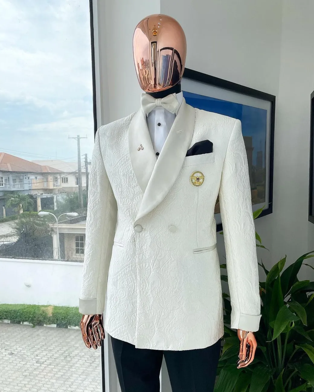 An ivory white Egyptian scritto pattern jacquard shawl lapel single button, double breasted Suit