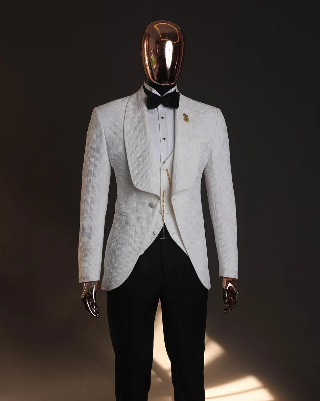 An Ivory white, elastic, basket weave layered floral jacquard shawl lapel tuxedo suit.