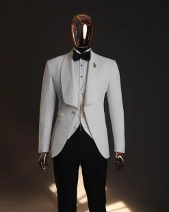 An Ivory white, elastic, basket weave layered floral jacquard shawl lapel tuxedo suit.