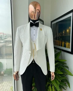 An Ivory white, elastic, basket weave layered floral jacquard shawl lapel tuxedo suit.