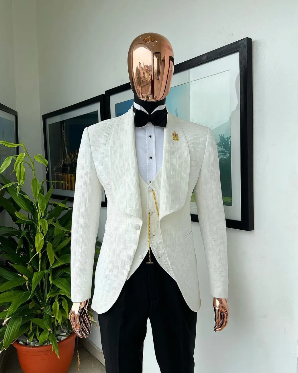 An Ivory white, elastic, basket weave layered floral jacquard shawl lapel tuxedo suit.