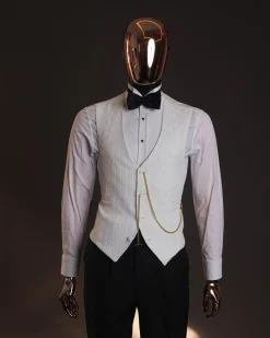 An Ivory white, elastic, basket weave layered floral jacquard shawl lapel tuxedo suit.