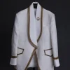 An ivory white floral Jacquard, gold trimmings, patch pocket shawl lapel tuxedo suit