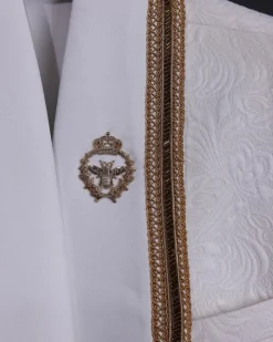 An ivory white floral Jacquard, gold trimmings, patch pocket shawl lapel tuxedo suit