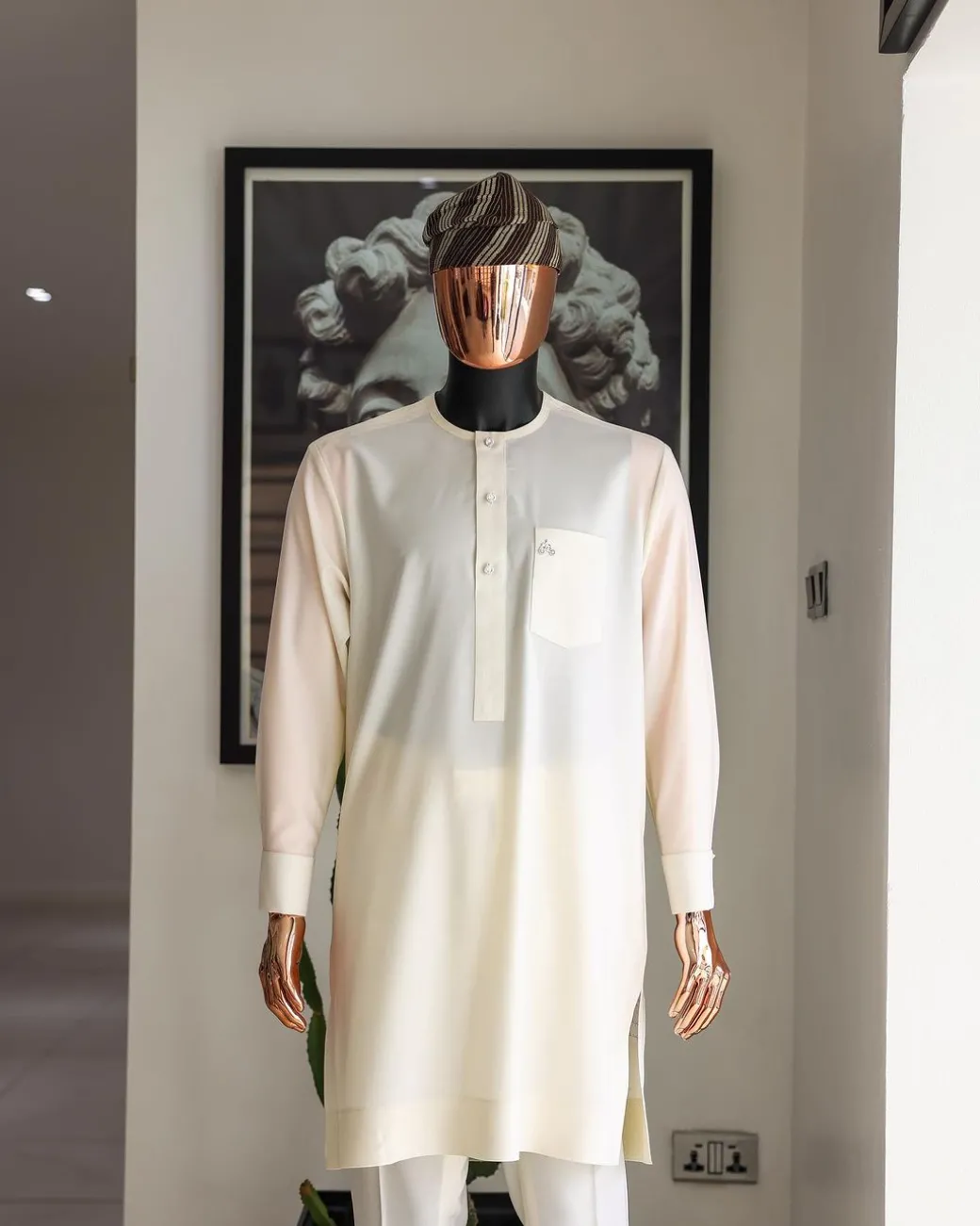 An Ivory white front flap with silver Swarovski button details, long-sleeve African senator kaftan native