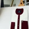 An Ivory white kaftan with a burgundy mix flap, pocket, and cuff design African Kaftan
