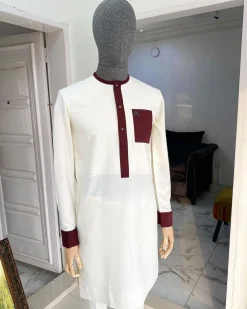 An Ivory white kaftan with a burgundy mix flap, pocket, and cuff design African Kaftan
