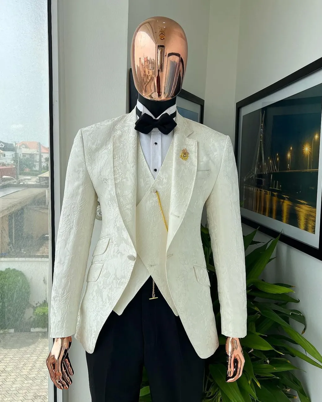 An ivory white, knitted, root floral jacquard notch tuxedo lapel suit