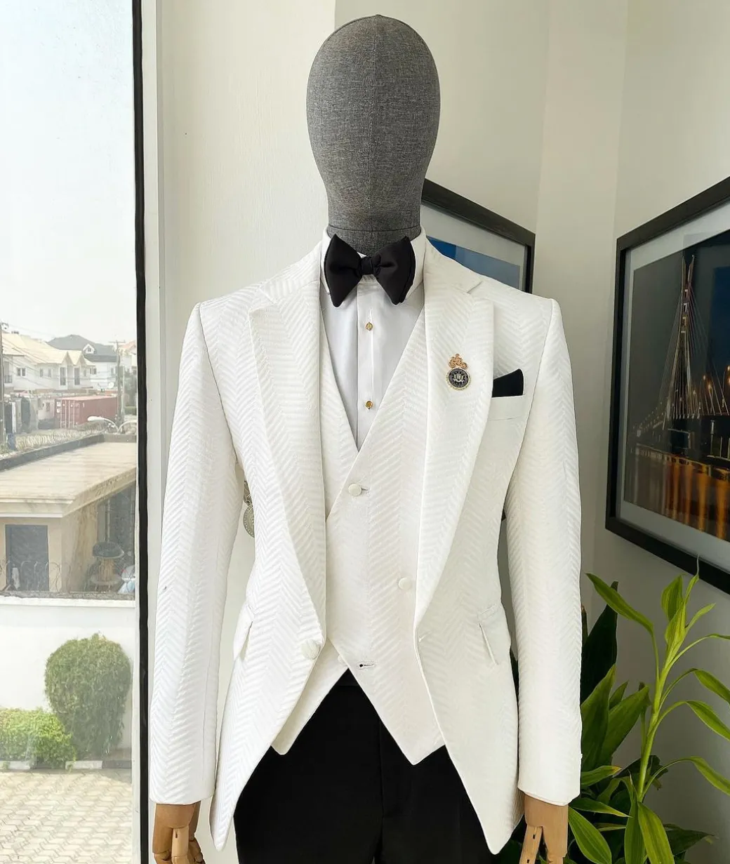 An Ivory white, notch lapel, infinity “maze” line Japanese patterned jacquard suit.