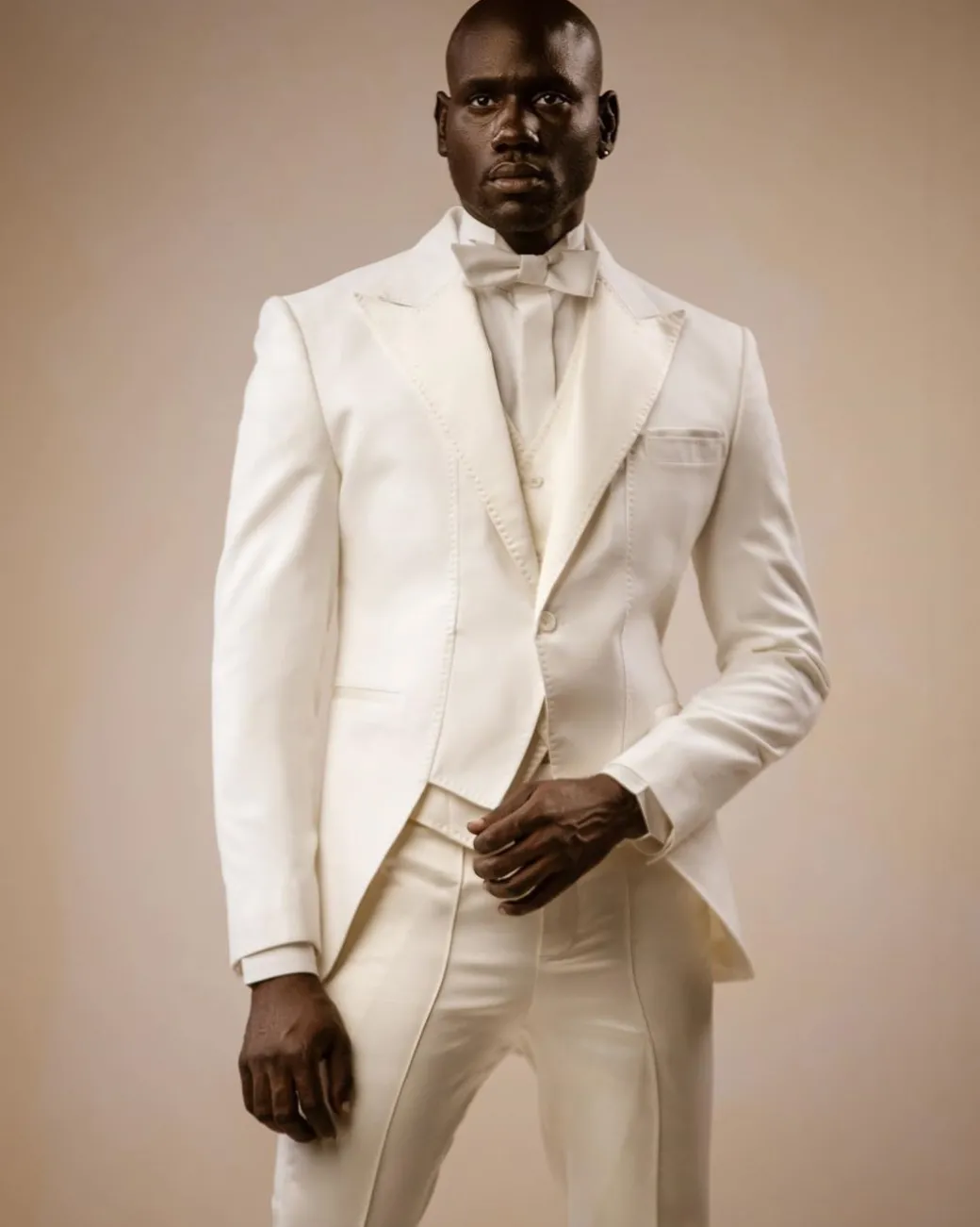 An Ivory White Peak lapel ”Short Front” tuxedo suit