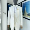 An Ivory white Reloaded “celestial” shawl lapel floral jacquard tuxedo suit.