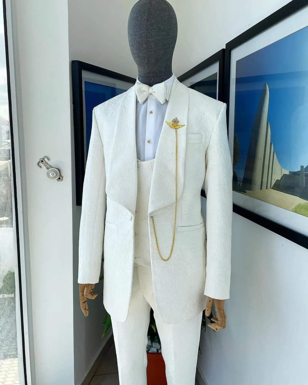 An Ivory white Reloaded “celestial” shawl lapel floral jacquard tuxedo suit.