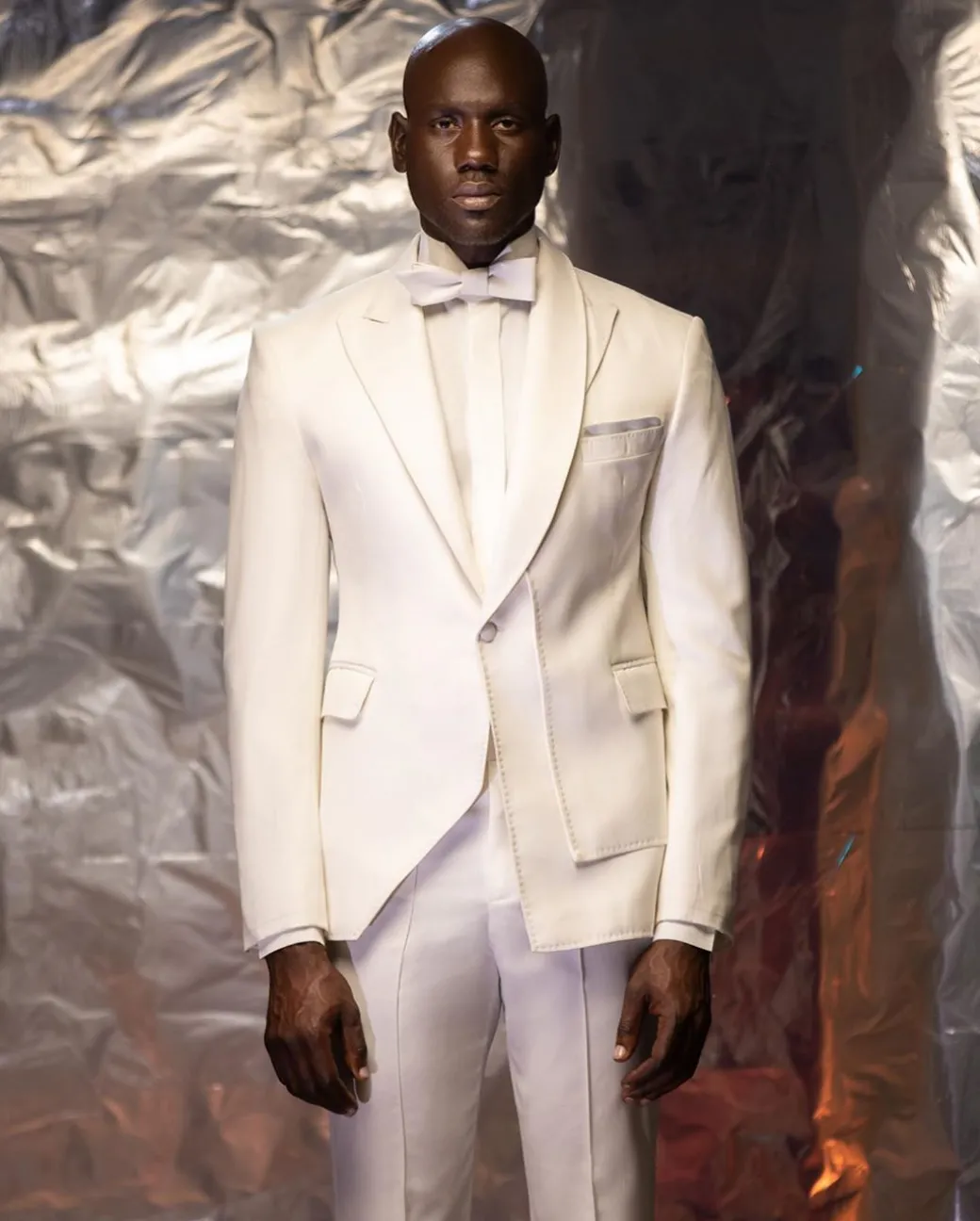An Ivory White Shawl and peak lapel Tuxedo suit
