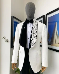 An Ivory white shawl lapel floral jacquard, satin taped lapel with floral details suit