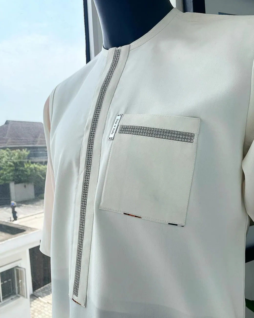 An Ivory white, Swarovski Clear Crystal Trim bling flap and pocket detailing, African traditional senator kaftan native.