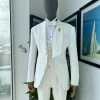 An Ivory white, swollen floral jacquard shawl lapel tuxedo suit.