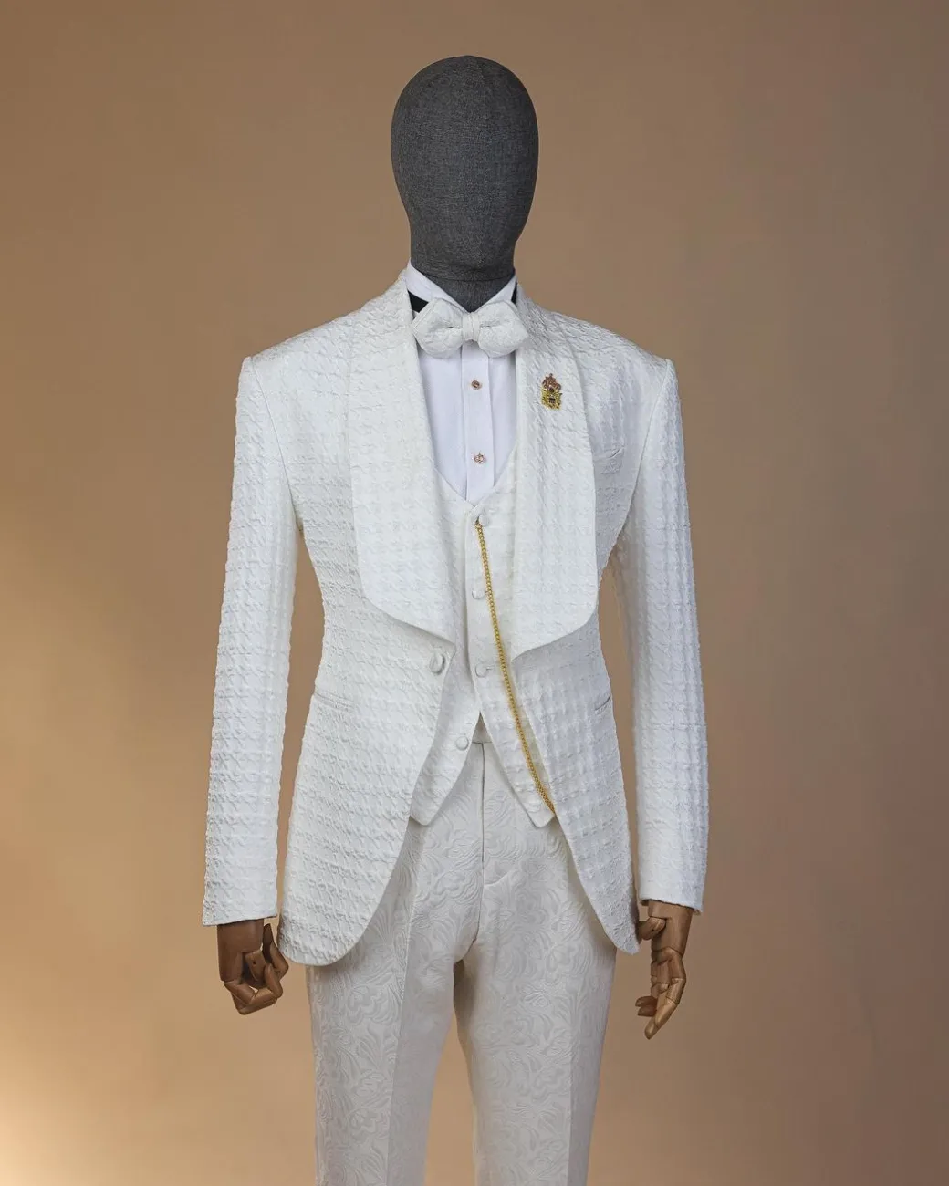 An Ivory white, swollen floral jacquard shawl lapel tuxedo suit.