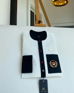 An Ivory white with a black flap, red detail button and royalty badge African Kaftan and Sokoto