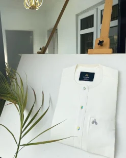 An Ivory white with a matching rainbow-shaded glass button African Kaftan