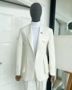 An Ivory white, x-large combat patch pocket, peak lapel suit