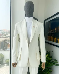 An Ivory white, x-large combat patch pocket, peak lapel suit