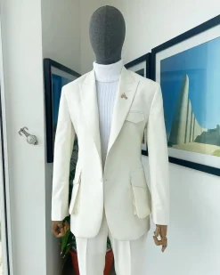 An Ivory white, x-large combat patch pocket, peak lapel suit
