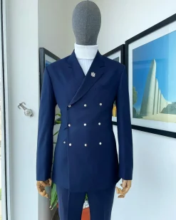 An Navy blue “ibiza” wrap suit with snap buttons detailing