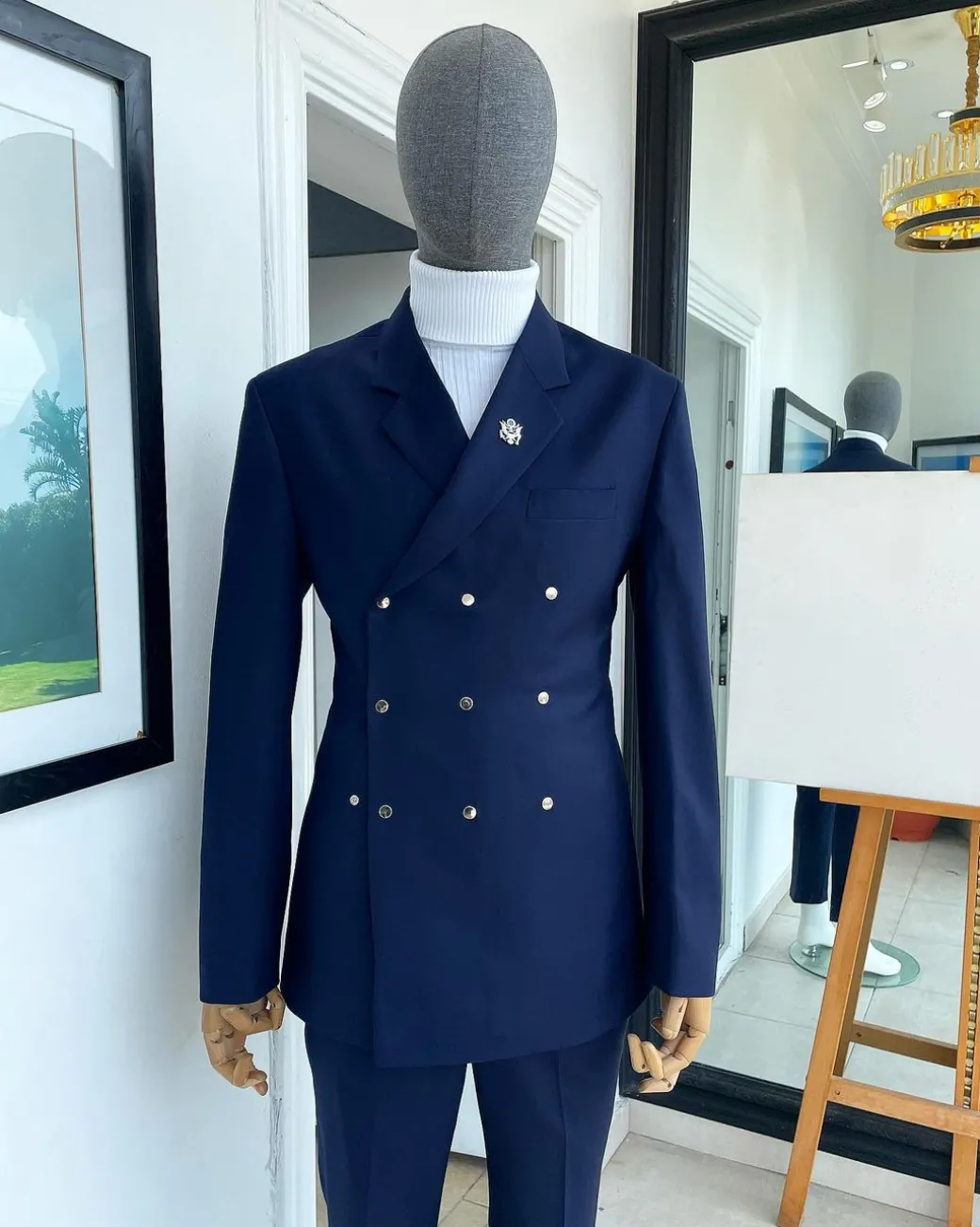 An Navy blue “ibiza” wrap suit with snap buttons detailing