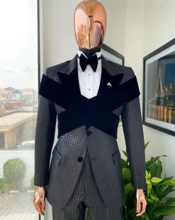 An “Octopus” black inverted square patterned metallic jacquard tuxedo with intersected black velvet peak lapel suit