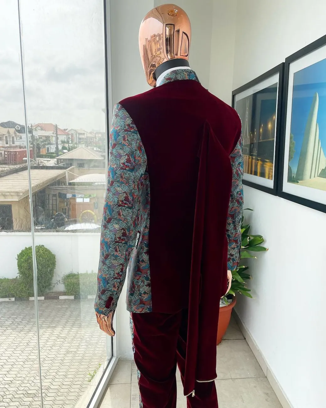 An “octopus” floral paisley tuxedo with intersected mahogany red soaked Italian velvet peak lapel suit