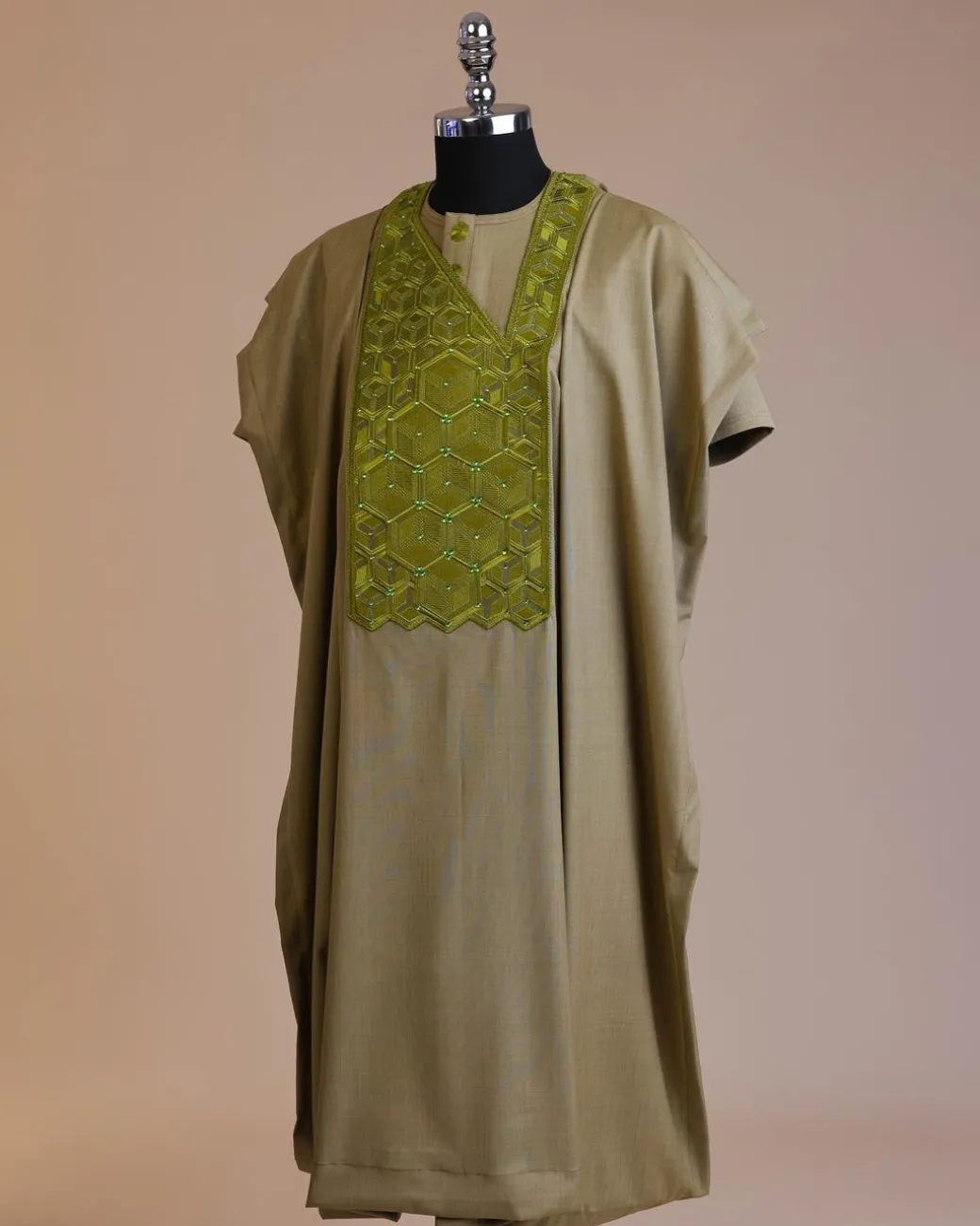 An Olive Green, Connected inverted cube -layered 3D embroidery design with splashed matching green ss30 Swarovski stone details agbada