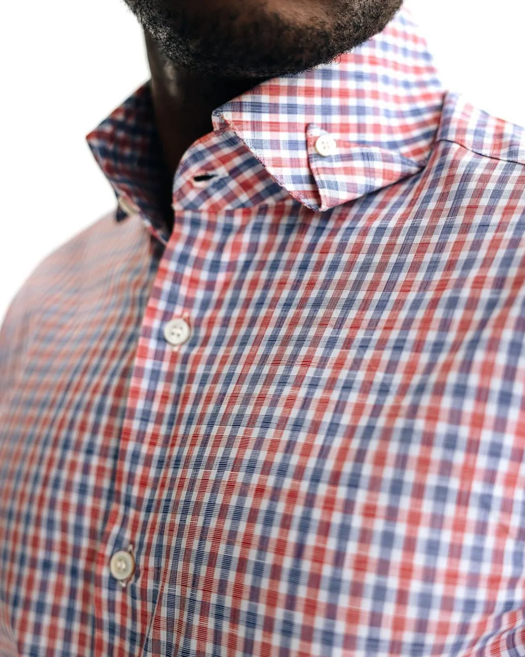 An Orange, blue & white plaid check with a high collar with a turn-up casual shirt.