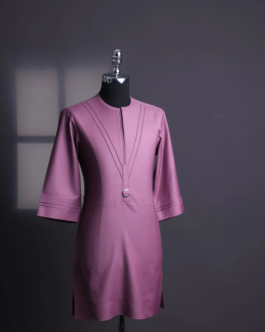 An orchid purple, pleated triangle with buckle intersection, 3/4 sleeve African senator kaftan native.