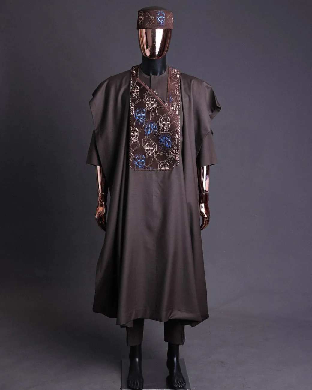 An Umber Brown, AI connected iron-man maze embroidery details agbada, mixed Swarovski buttons on 3/4 sleeve kaftan & sokoto