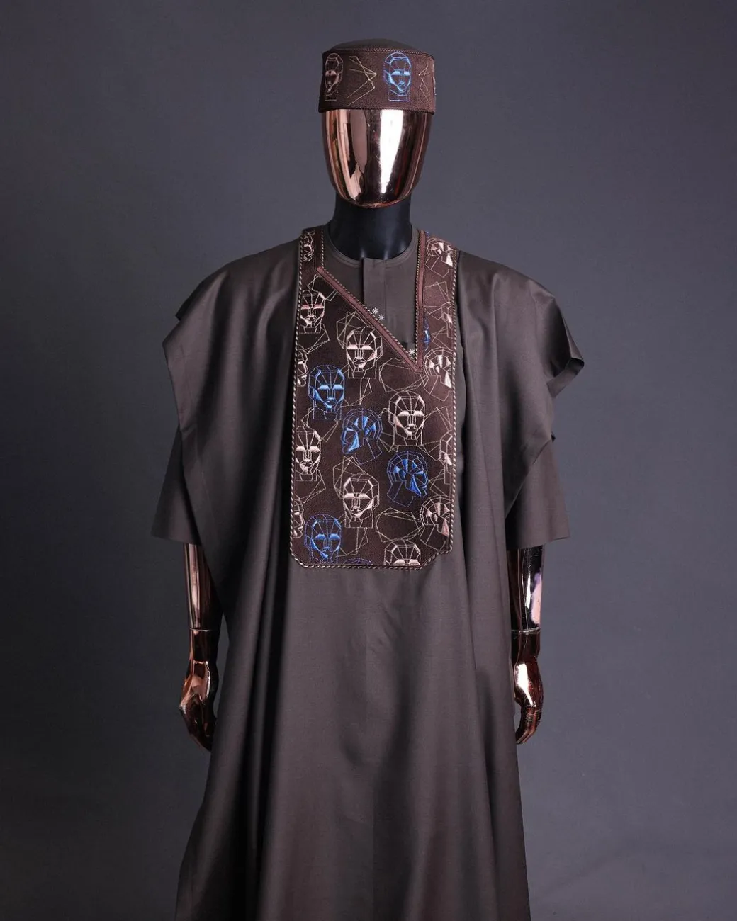 An Umber Brown, AI connected iron-man maze embroidery details agbada, mixed Swarovski buttons on 3/4 sleeve kaftan & sokoto