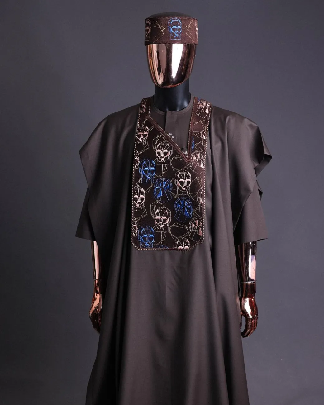 An Umber Brown, AI connected iron-man maze embroidery details agbada, mixed Swarovski buttons on 3/4 sleeve kaftan & sokoto