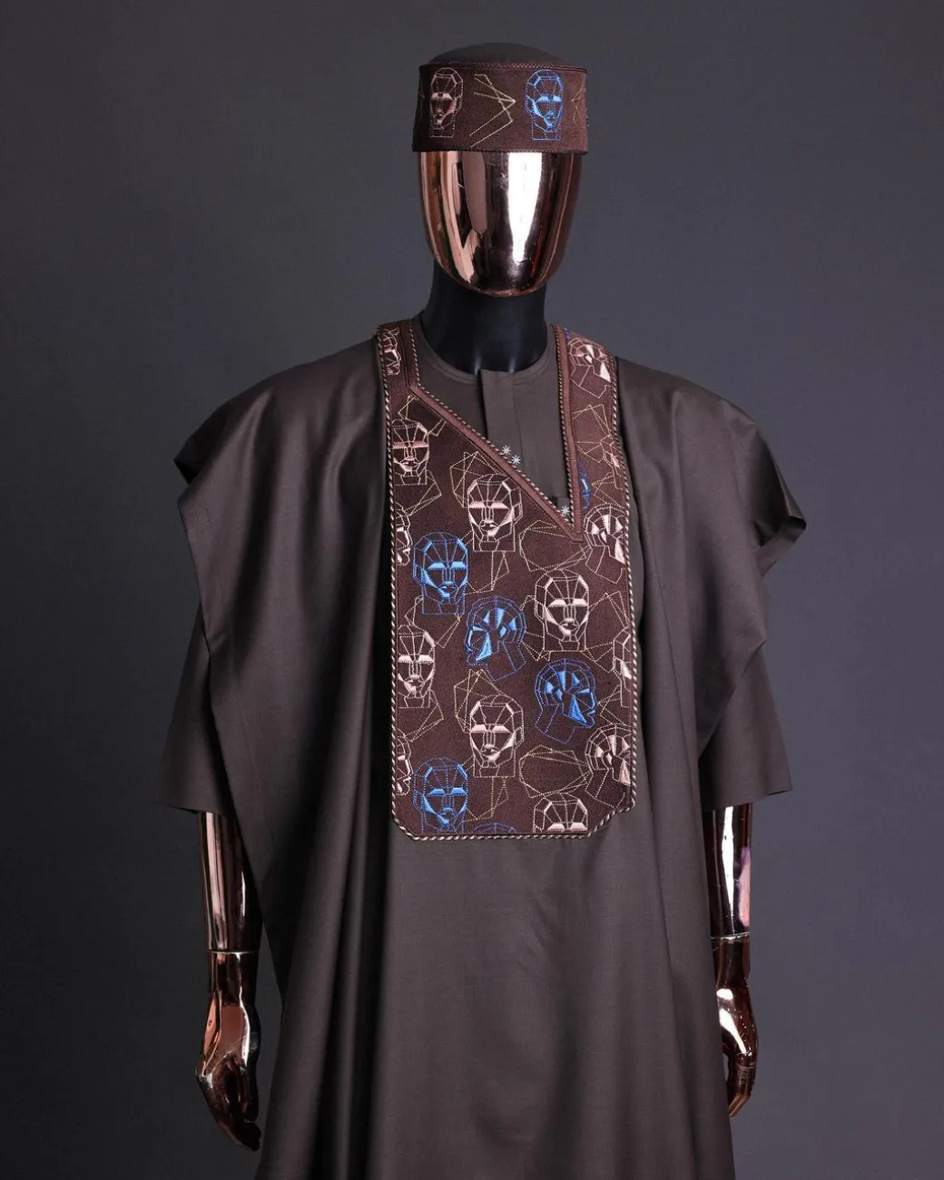 An Umber Brown, AI connected iron-man maze embroidery details agbada, mixed Swarovski buttons on 3/4 sleeve kaftan & sokoto