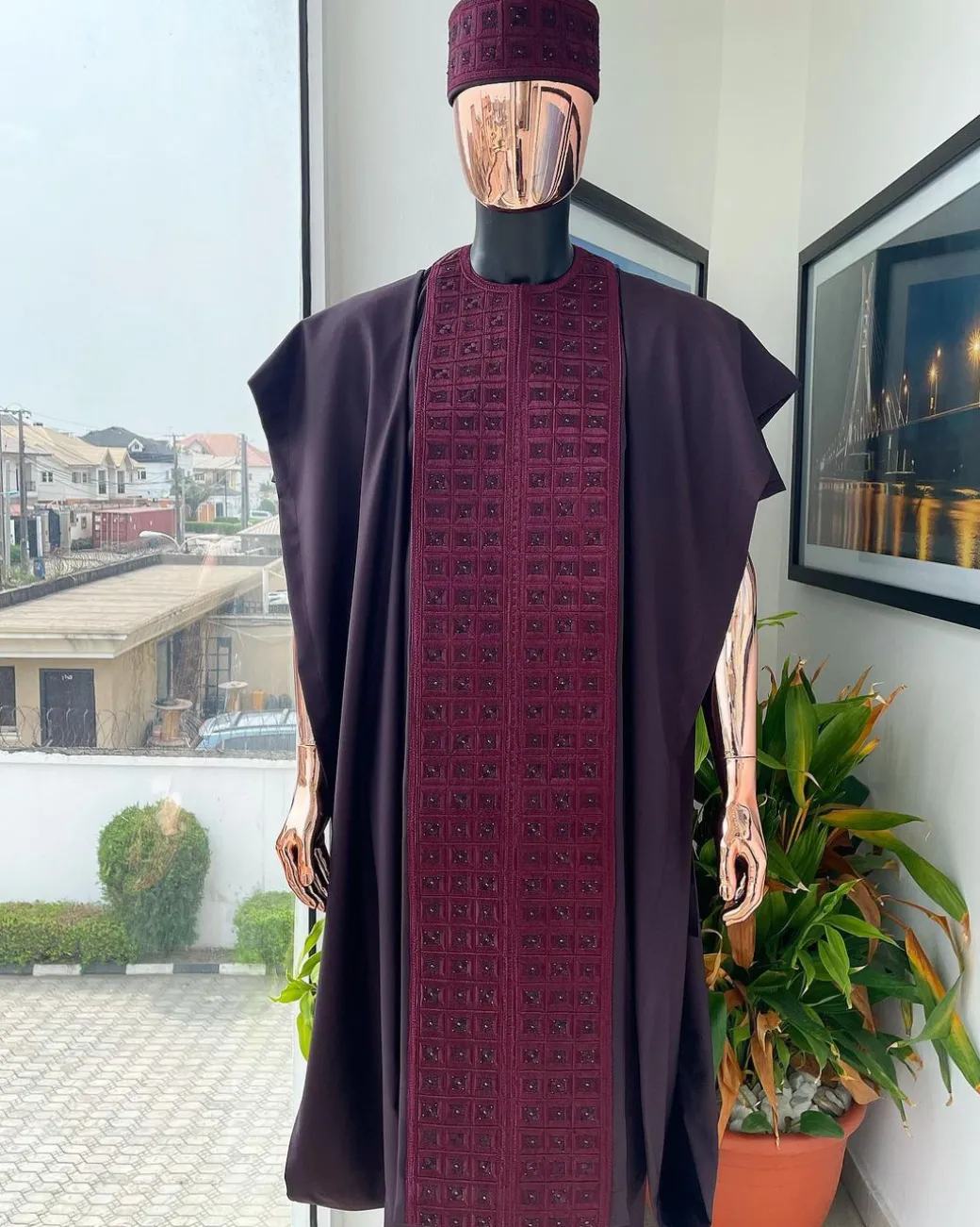 An Umber brown, connected square embroidery design with matching black and brown Swarovski stone details agbada, matching hat, buba & sokoto