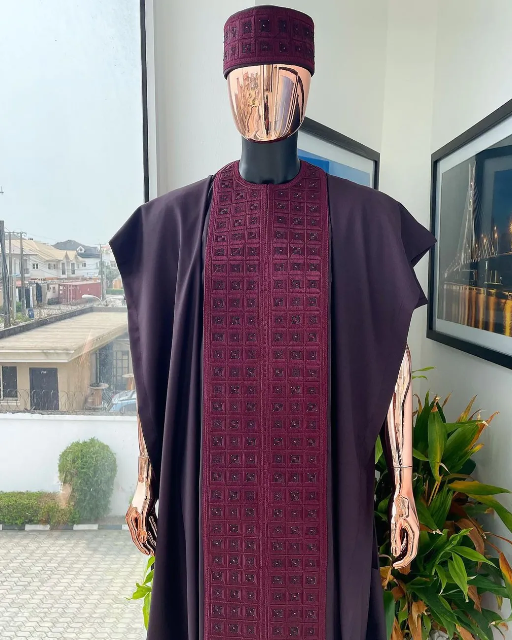 An Umber brown, connected square embroidery design with matching black and brown Swarovski stone details agbada, matching hat, buba & sokoto